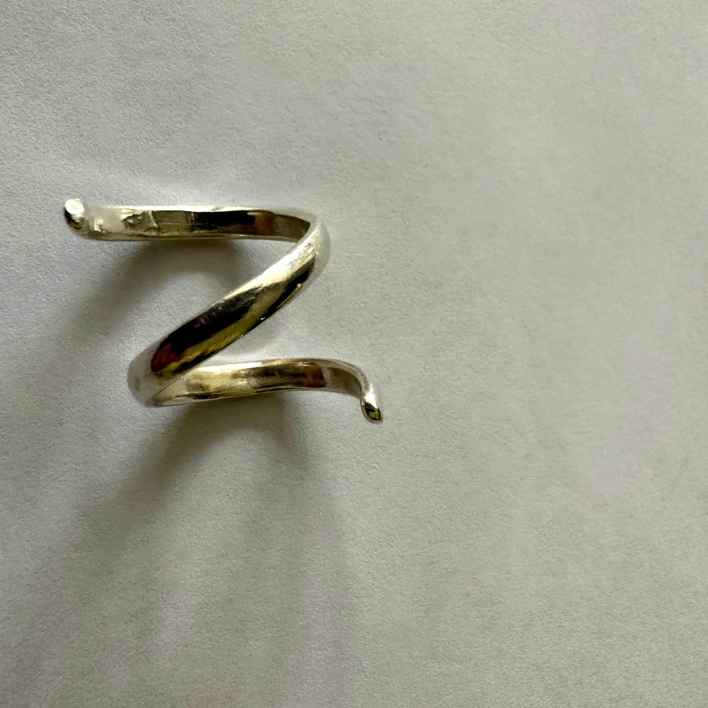 Sterling silver custom ring, roughly a size 7 - 7.5. Very sturdy quality